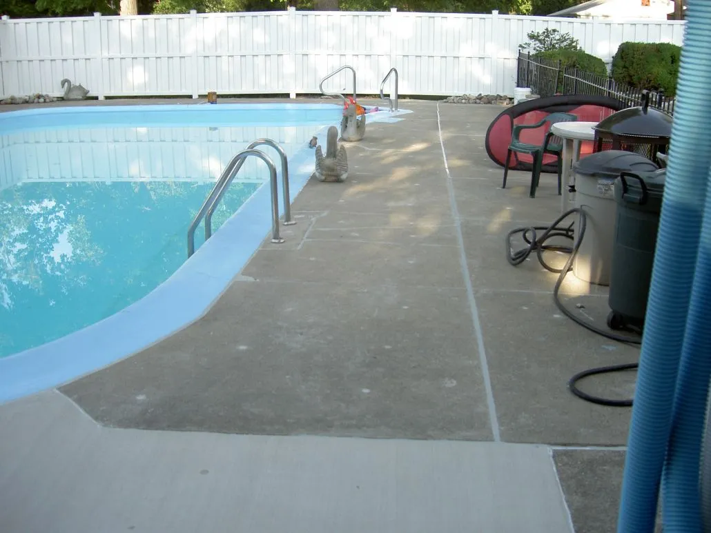 Poolside view with clear water and lounge area