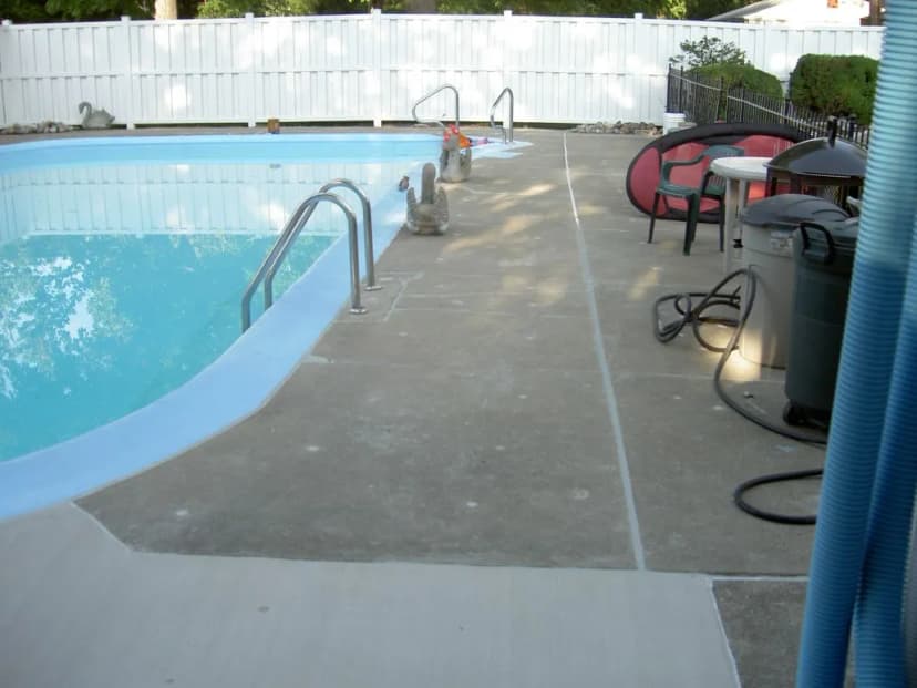 Poolside view with clear water and lounge area
